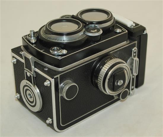 A Rolleiflex 3.5 Planar Xenotar camera and instruction book